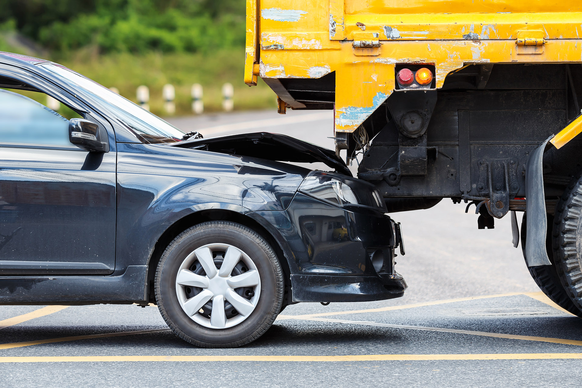 Rear end accident with car into the back of a large truck